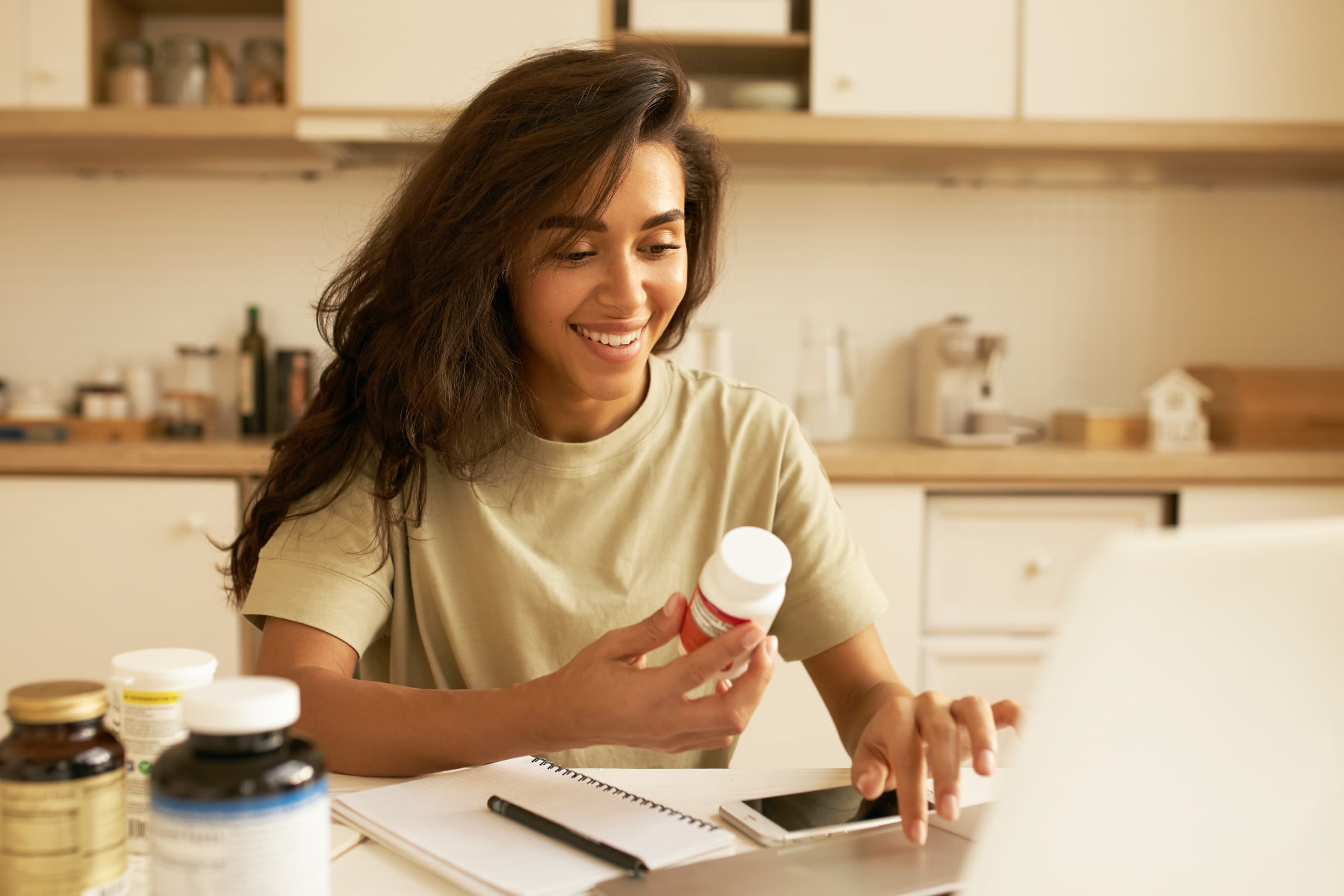 Happy woman holding tablet box