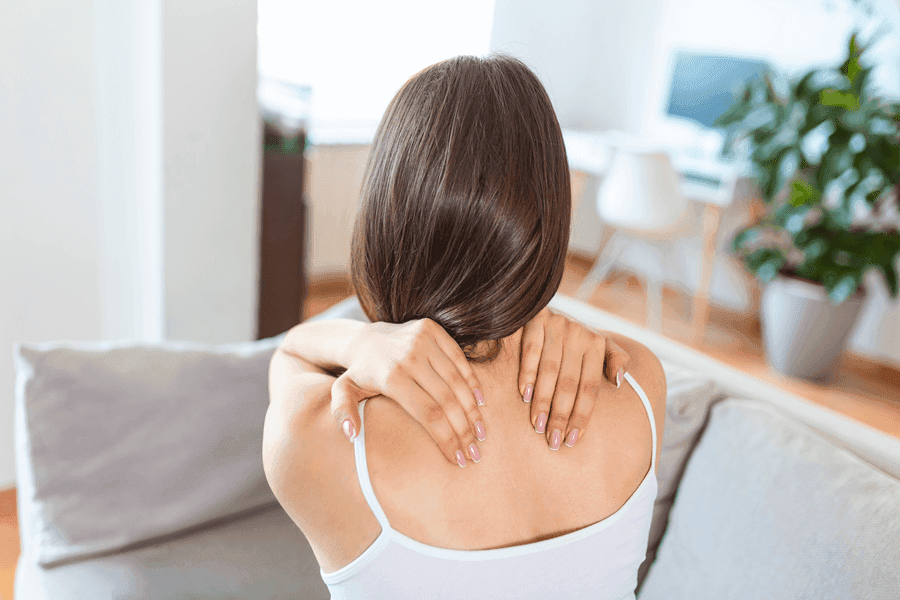 Woman holding Shoulders