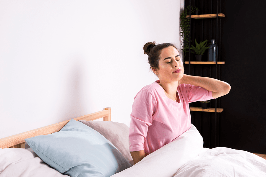 Woman sitting on Bed