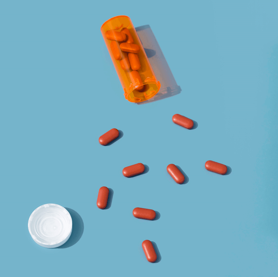 Red Pills with Plastic Container