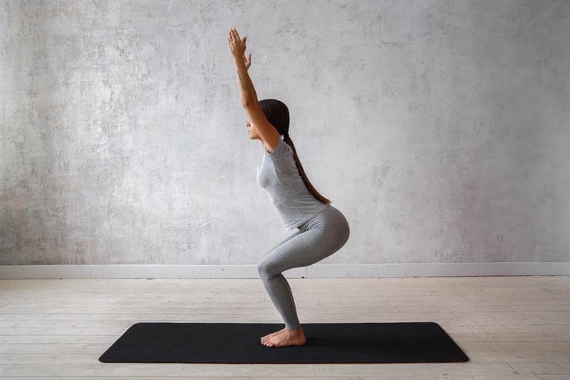 Woman doing Yoga for easing knee pain