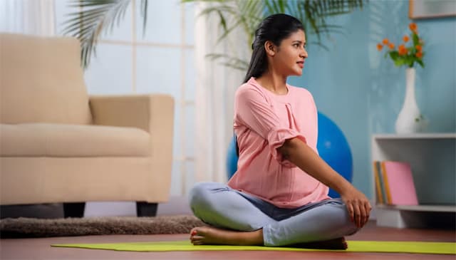 Pregnant woman doing Yoga