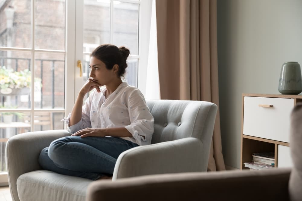Woman sitting on sofa